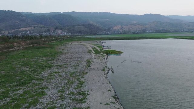 Aerial View of Lake Shoreline and Mountains