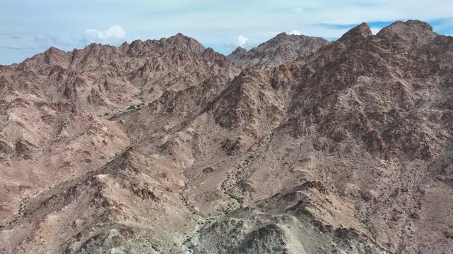 drone climbing over rocky hills near the Cargo Muchacho mountains 