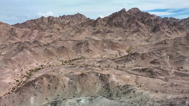 drone flying through dramatic scenery near the Cargo Muchacho mountains 