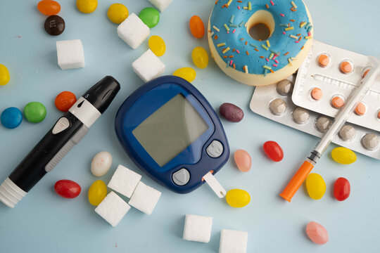 Diabetes with digital blood glucose measure with sugar.