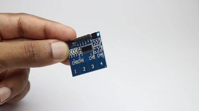 Capacitor touch sensor module commonly used in prototyping electronic projects held in the hand