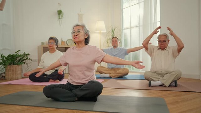 Caregiver senior wellness nursing home yoga group elder adult pose meditation gentle exercise indoor mobility support calm healthy aging care practice bright room mat movement focus