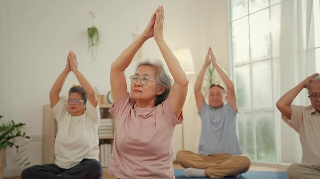 Senior wellness nursing home caregiver yoga meditation exercise calm group practice gentle stretch bright room balance mobility health support for elderly aging