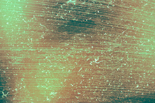Abstract dusty distressed texture with blue and green gradient light leaks, creating a vintage grunge film effect for backgrounds, photo overlays, posters and creative design.