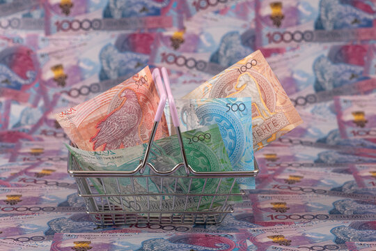 Kazakhstani tenge banknotes in a shopping basket