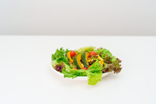 fresh organic vegetables salad on plate. healthy nutrition, weight loss, clean eating, Healthy food eating, Vegan, Wellness, Green dieting and Healthy lifestyle