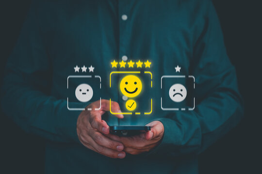 Man using smartphone for positive customer feedback and glowing 5 star rating. Concept of excellent business service, digital user experience survey, and satisfaction review.