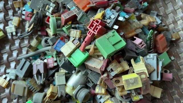 Used Automotive Fuses Relays and Electrical Components in Vehicle Repair Workshop