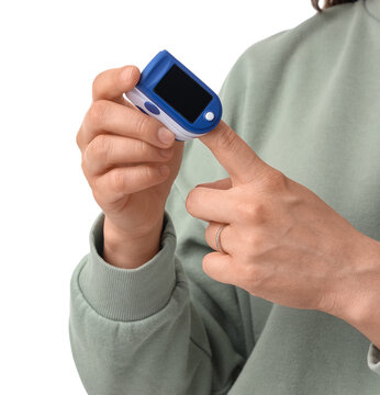 Pulse oximetry and health monitoring, person using a digital finger pulse oximeter to check blood oxygen saturation levels and heart rate at home