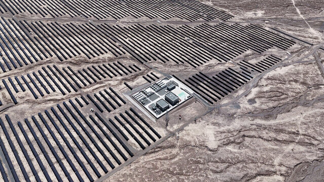 solar power station with photovoltaic panels in desert area