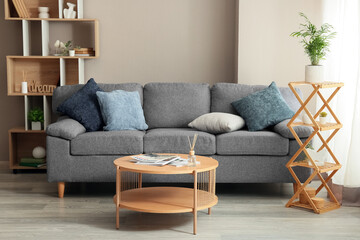 Interior design and home comfort, modern living room with grey sofa and wooden coffee table in a cozy apartment for lifestyle and real estate marketing © Pixel-Shot