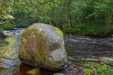 Serene Wilderness Stream and Natural Boulder. © Ludmila Smite