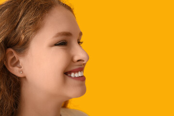 Happiness and wellness, smiling young woman profile portrait with positive emotion and healthy skin on a vibrant yellow background for beauty marketing © Pixel-Shot