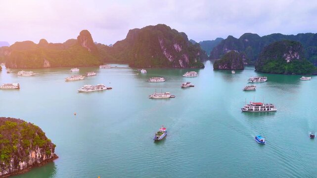 Aerial view of Ha Long Bay, Vietnam with cruise ships, islands among limestone islands. UNESCO World Heritage Site. Popular landmark, famous destination of Vietnam