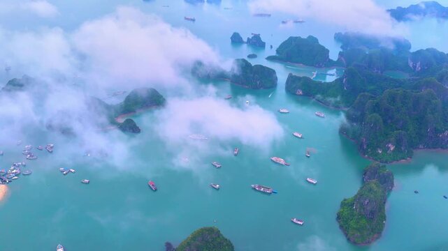 Aerial view of Ha Long Bay, Vietnam with cruise ships, islands among limestone islands. UNESCO World Heritage Site. Popular landmark, famous destination of Vietnam