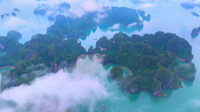 Aerial view of Ha Long Bay, Vietnam with cruise ships, islands among limestone islands. UNESCO World Heritage Site. Popular landmark, famous destination of Vietnam
