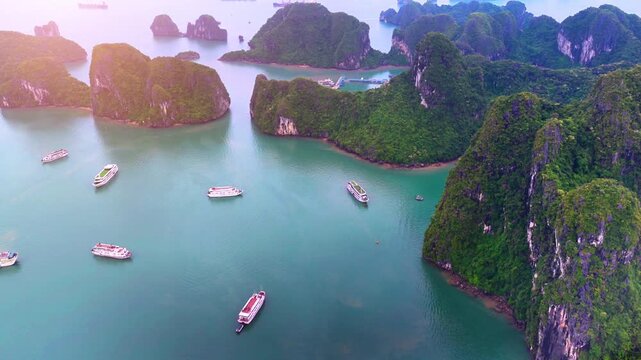 Aerial view of Ha Long Bay, Vietnam with cruise ships, islands among limestone islands. UNESCO World Heritage Site. Popular landmark, famous destination of Vietnam