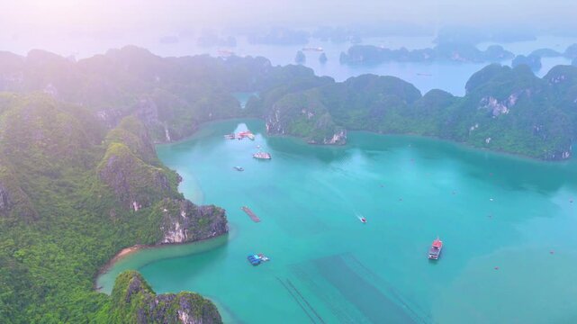 Aerial view of Ha Long Bay, Vietnam with cruise ships, islands among limestone islands. UNESCO World Heritage Site. Popular landmark, famous destination of Vietnam