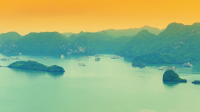 Aerial view of Ha Long Bay, Vietnam with cruise ships, islands among limestone islands. UNESCO World Heritage Site. Popular landmark, famous destination of Vietnam