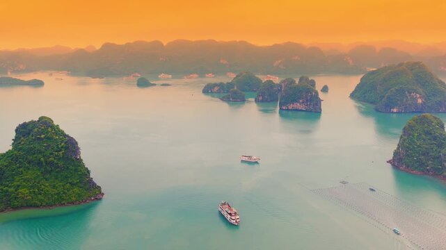 Aerial view of Ha Long Bay, Vietnam with cruise ships, islands among limestone islands. UNESCO World Heritage Site. Popular landmark, famous destination of Vietnam