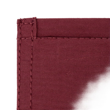 Cotton poplin patch pocket corner in burgundy featuring two tight wine thread bar tacks on transparent background