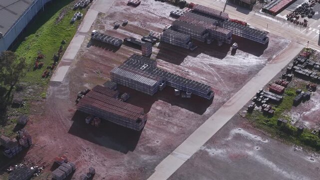 Scoresby, Australia - 13 September 2026: Aerial view of PGH Bricks and Pavers Selection Centre with neatly stacked bricks and pavers in an industrial yard.
