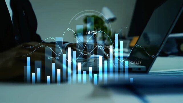 Businessman uses laptop and hologram digital financial charts animation overlaid on a blurred office desk, showing market analysis, growth and data tracking
