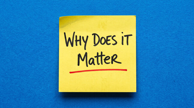 Sticky note with handwritten why does it matter text underlined in red on solid blue background for office reminders and critical questioning.