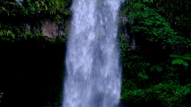 Scenic pan down Tavoro waterfall in Bouma National Heritage Park on Taveuni Island, Fiji, South Pacific