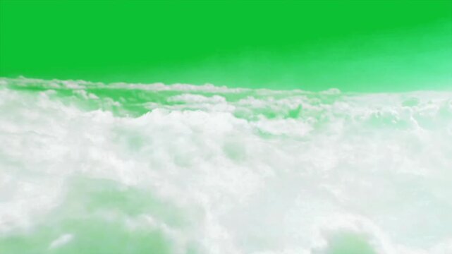 Fluffy white clouds moving softly over sea horizon above a keyable chroma key green screen background