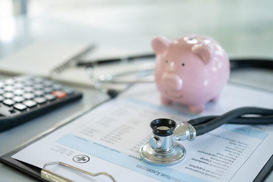 financial planning for health  and investment in health insurance  concept. medical stethoscope and piggy bank with medical billing.