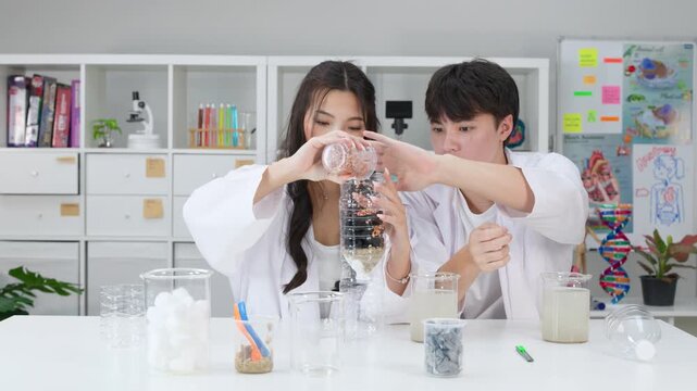 Teenage Students Conducting Water Filtration Science Experiment in Classroom