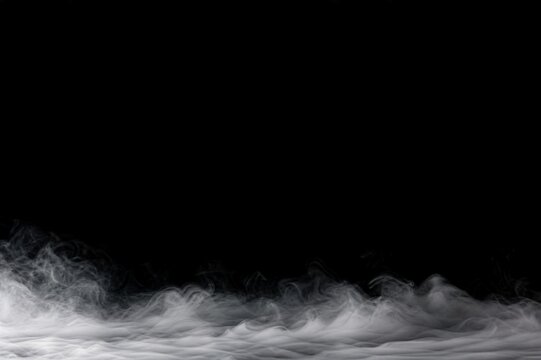Low white fog along the bottom of a black background for cinematic product and luxury advertising.