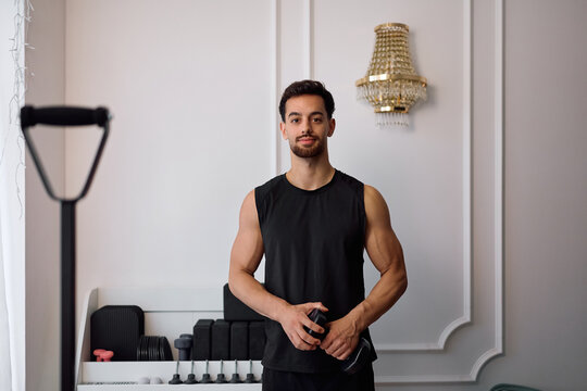 Portrait of smiling Pilates instructor looking at camera.