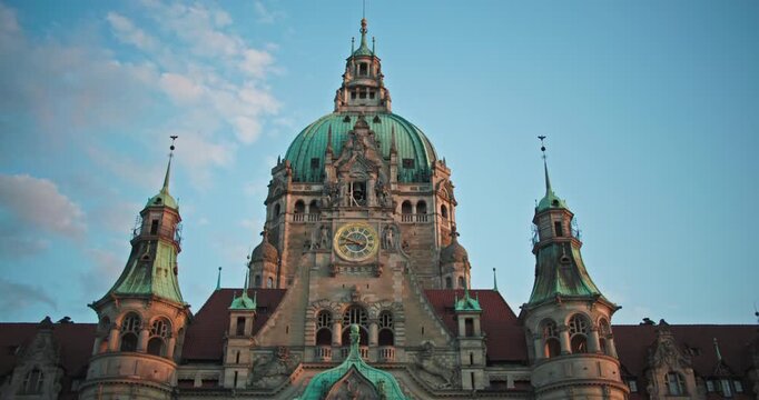 New Town Hall clock Hannover Germany stands above historic architecture with beautiful urban cityscape views and iconic landmarks for European travel and tourism 