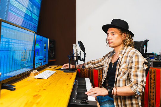 Music producer working in home recording studio