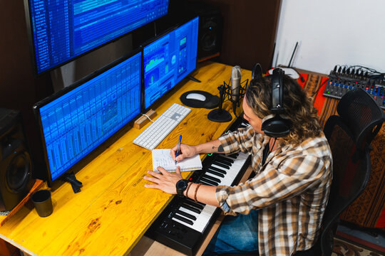 Music producer creating song in home studio