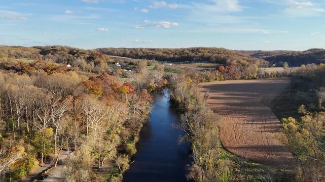Aerial view of the Brandywine River winding through an autumn landscape near First State National Historical Park in Wilmington, Delaware