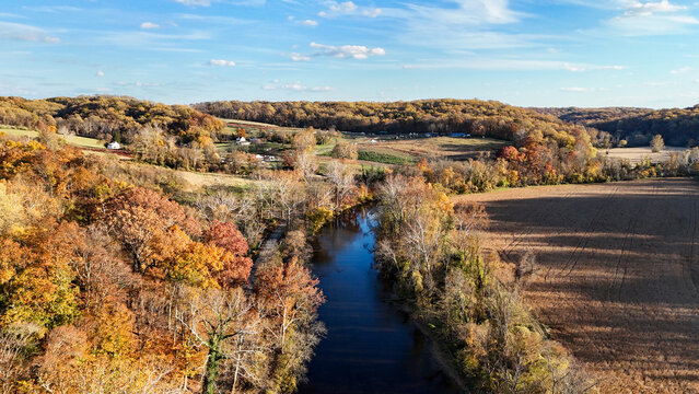 Aerial view of the Brandywine River winding through an autumn landscape near First State National Historical Park in Wilmington, Delaware