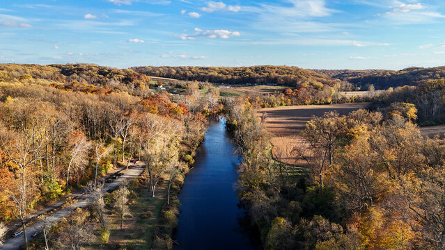 Aerial view of the Brandywine River winding through an autumn landscape near First State National Historical Park in Wilmington, Delaware