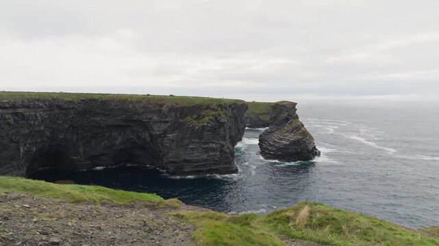 Diamond Rocks on the Kilkee coast in County Clare, Ireland, features aerial sea cliffs and an offshore rock stack above Atlantic surf, a destination for coastal sightseeing.