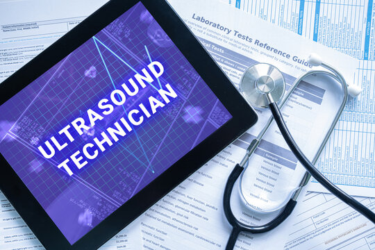 ULTRASOUND TECHNICIAN text on digital tablet screen with stethoscope and documents, medical specialist healthcare concept