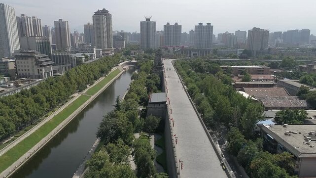 Raw footage of Aerial drone view of ancient city wall in Xian. Xian in China panorama from drone. Xian old town in China Asia. Fortifications of Xian City Wall.