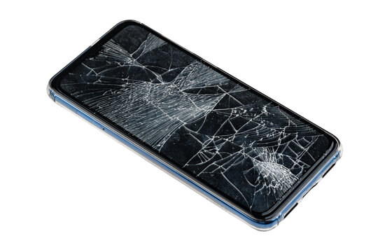 Smartphone with cracked screen lying on a flat surface in a well-lit area