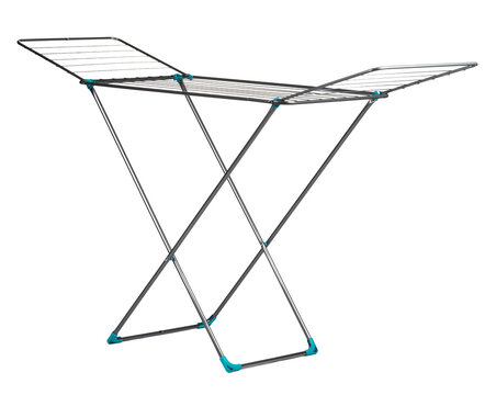 Drying rack set up for laundry in a bright indoor space during the day