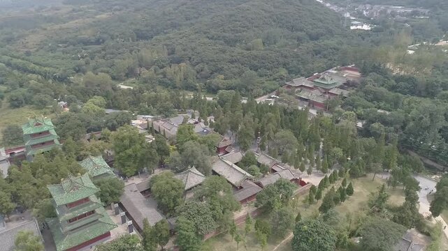 Raw footage of Aerial drone view of  Shaolin temple in Henan Province, China, Asia. Pagoda Forest at Shaolin Temple in China Asia. Shaolin Monastery from drone.
