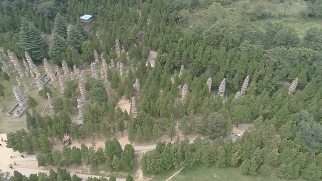 Raw footage of Aerial drone view of  Shaolin temple in Henan Province, China, Asia. Pagoda Forest at Shaolin Temple in China Asia. Shaolin Monastery from drone.
