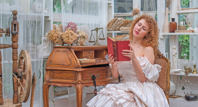 Romantic Victorian Woman Reading an Old Book. Perfect for concepts of reading, women&rsquo;s fiction, classic literature, imagination and book lovers