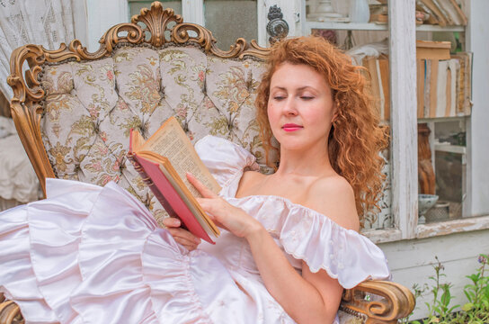 Romantic Victorian Woman Reading an Old Book. Perfect for concepts of reading, women&rsquo;s fiction, classic literature, imagination and book lovers