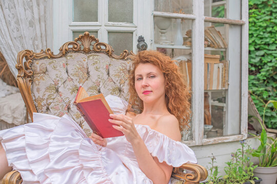 Romantic Victorian Woman Reading an Old Book. Perfect for concepts of reading, women&rsquo;s fiction, classic literature, imagination and book lovers
